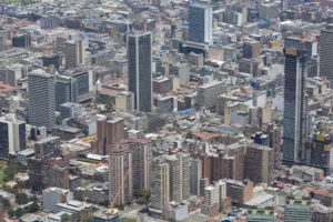 An aerial view of Bogotá, Colombia showcasing dense urban architecture with numerous high-rise buildings.