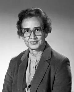 Mature woman with glasses in a formal suit.
