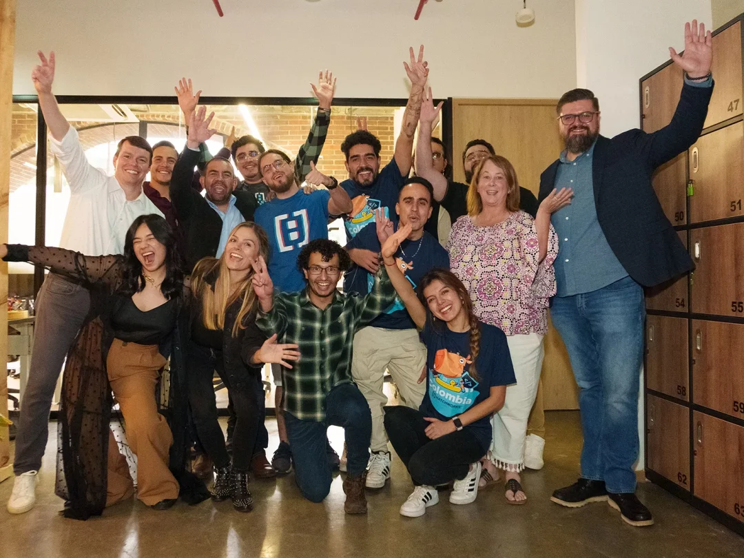 A group shot of Colombian Hatchers, gathered and smiling in their new HatchWorks office space.